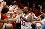 Arkansas junior Marshawn Powell and teammates celebrate with fans following their 73-62 win over Texas A&M on Saturday, March 9, 2013, at Bud Walton Arena in Fayetteville.