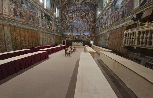 a-view-of-the-sistine-chapel-at-the-vatican-saturday-march-9-2013-firefighters-have-installed-the-top-of-the-sistine-chapel-chimney-that-will-signal-to-the-world-that-a-new-pope-has-been-elected-while-construction-workers-were-preparing-the-chapel-interior-for-the-start-of-the-papal-conclave-tuesday-for-such-an-important-decision-the-chimney-is-an-awfully-simple-affair-a-century-old-cast-iron-stove-where-ballot-papers-are-burned-with-a-copper-pipe-out-the-top-that-snakes-up-the-sistines-frescoed-walls-out-the-window-and-onto-the-chapel-roof