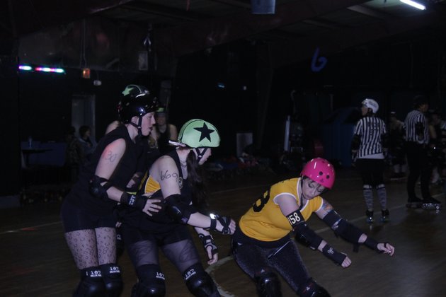 a-member-of-the-girls-rollin-in-the-south-roller-derby-league-blocks-a-fellow-skater-during-the-leagues-first-public-scrimmage-of-the-season-on-feb-26-at-the-conway-roller-rink