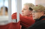 Arkansas coach Chris Bucknam, left, and assistant Danny Greene watch Saturday, Jan. 26, 2013, during the Razorback Invitational at the Randal Tyson Track Center in Fayetteville.
