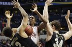 Arkansas guard BJ Young (11) works against Vanderbilt' Shelby Moats (34) and Kedren Johnson (2) during the second half of an NCAA college basketball game at the Southeastern Conference tournament, Thursday, March 14, 2013, in Nashville, Tenn. (AP Photo/Dave Martin)