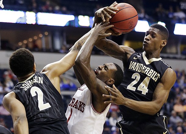arkansas-guard-mardracus-wade-1-vies-for-a-loose-ball-with-vanderbilts-dai-jon-parker-24-and-kedren-johnson-2-during-the-first-half-of-an-ncaa-college-basketball-game-at-the-southeastern-conference-tournament-thursday-march-14-2013-in-nashville-tenn-ap-photojohn-bazemore
