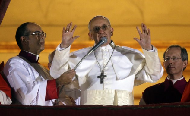 pope-francis-waves-to-the-crowd-from-the-central-balcony-of-st-peters-basilica-at-the-vatican-wednesday-march-13-2013-cardinal-jorge-bergoglio-who-chose-the-name-of-francis-is-the-266th-pontiff-of-the-roman-catholic-church