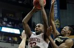 Arkansas's Marshawn Powell shoots over Vanderbilt defenders Shelby Moats, Kendren Johnson and Rod Odom during their Southeastern Conference tournament game in Nashville Thursday.