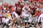 Arkansas quarterback Brandon Allen is tripped up by Alabama defensive lineman Quinton Dial during the fourth quarter of play Saturday, Sept. 15, 2012, at Razorback Stadium in Fayetteville.