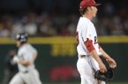 Arkansas starter Trey Killian reacts to giving up a solo home run by Ole Miss first baseman Sikes Orvis Friday, March 15, 2013, during the fourth inning of play at Baum Stadium in Fayetteville.