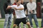 Quarterback Tyler Wilson runs drills for NFL scouts Friday afternoon at Walker Pavilion during Pro Day at the University of Arkansas in Fayetteville.