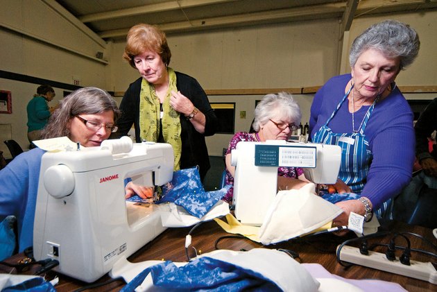 from-the-left-rebecca-manus-ruth-hook-karen-warner-and-linda-dingley-participate-in-a-sewing-party-at-greenbrier-church-of-the-nazarene-to-make-care-caps-for-cancer-patients