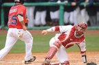 Ole Miss third baseman Andrew Mistone scores as Arkansas catcher Jake Wise loses the throw from the field Sunday, March 17, 2013, during the fourth inning of play against Arkansas at Baum Stadium.