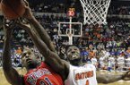 Florida center Patric Young (4) vies for a rebound with Mississippi forward Murphy Holloway (31) during the first half of an NCAA college basketball game in the final round of the Southeastern Conference tournament, Sunday, March 17, 2013, in Nashville, Tenn. (AP Photo/John Bazemore)