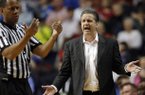 Kentucky head coach John Calipari reacts to a call during the first half of an NCAA college basketball game against the Vanderbilt at the Southeastern Conference tournament, Friday, March 15, 2013, in Nashville, Tenn. (AP Photo/Dave Martin)