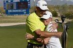 Stacy Lewis gets a hug from her father Dale after winning the LPGA Founders Cup on Sunday afternoon in Phoenix. The former Arkansas Razorback shot a 64 in the final round. 
