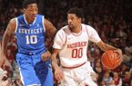 Arkansas sophomore guard Rashad Madden (00) drives with the ball as Kentucky freshman guard Archie Goodwin during the second half of play Saturday, March 2, 2013, in Bud Walton Arena in Fayetteville.