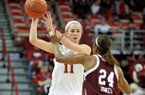 Arkansas point guard Calli Berna tries to get the ball past Texas A&M defender Jordan Jones during a game at Bud Walton Arena in Fayetteville.