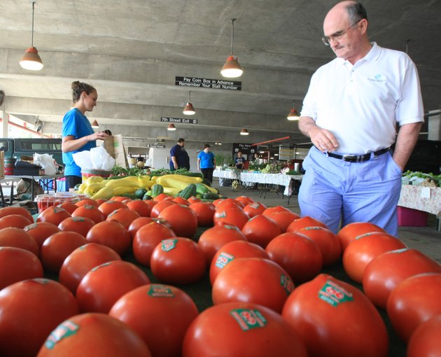file-fred-roberson-right-buys-produce-may-26-2012-at-the-little-rock-farmers-market-from-kristi-jensen-at-ricks-farm-stand