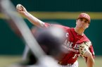 Arkansas starting pitcher Barrett Astin delivers a pitch against Evansville during the first inning on Saturday, Feb. 23, 2013, at Baum Stadium in Fayetteville.