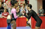 Arkansas gymnastics co-head coach Rene Lyst talks with gymnast Keara Glover before she competes on the beam during Friday night's meet against Florida at Barnhill Arena in Fayetteville. 