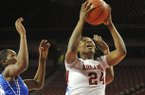 Arkansas forward Quistelle Williams drives to the hoop past a Memphis defender during Thursday night's game in the WNIT tournament at Bud Walton Arena in Fayetteville.