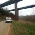 An ambulance and poiice cars near were a believed jumpers body was found off the I-540 bridge near W...