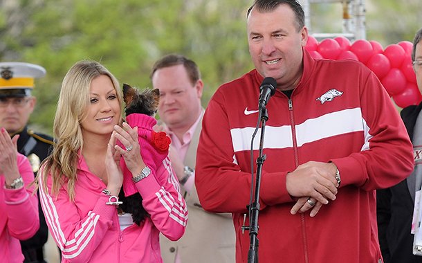 Arkansas head football coach Bret Bielema, right, and wife Jen, welcome attendees to the 15th annual Komen Ozark Race for the Cure Saturday, April 27, 2013, at Pinnacle Hills Promenade in Rogers. The event hosted 10K and 5K competitive runs, a 5K fun run, 1K family fun run, survivors breakfast and lots of free giveaways from local vendors.