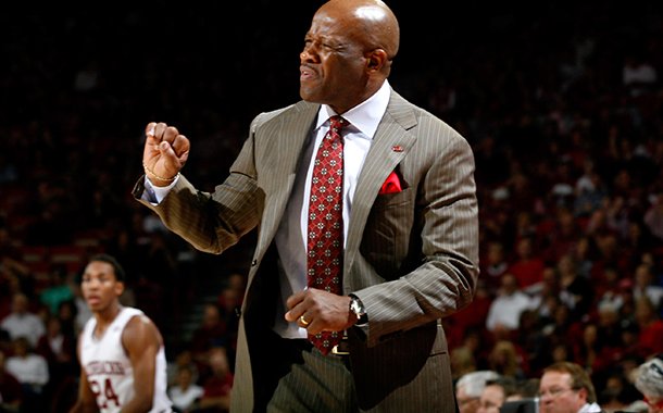 Arkansas head coach Mike Anderson signals to his players during the second half against Texas A&M on Saturday, March 9, 2013, at Bud Walton Arena in Fayetteville.