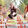 Gentry junior Jerod Cousins leads his heat in the 110 meter hurdles at the district track meet held in Gravette on Thursday.