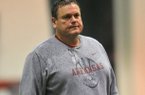 Arkansas assistant coach Sam Pittman works with the Razorbacks during practice March 30, 2013 in Fayetteville.