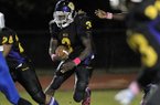 South Plantation running back Alex Collins looks for a hole in the Coral Springs defense in this October 21, 2011, file photo. (Michael Laughlin/Sun Sentinel/MCT)