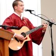 Kevin Parish sang "Time of Your Life" during graduation exercises on Friday at the Bill George Arena in Siloam Springs. 