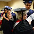 Casey Paraday, right, hugs English teacher Terri Garrison backstage Thursday before the start of Shi...