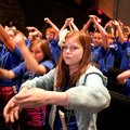 Brianna Kaubfleisch of Vandergriff Elementary School performs a dance with fourth-grade classmates a...