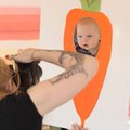 Mitsi McKee of M Photography, a volunteer photographer, takes a photograph of 6-month-old Nicholas A...