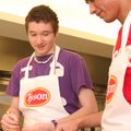 Jose Naranjo and Juan Acosta, both juniors at Rogers High School, garnish quesadillas they made duri...