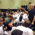 Barry Lunney, Bentonville head football coach, instructs his players to take shelter Monday inside t...