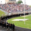 Led by Gravette High School faculty members, Gravette's 101 graduates for 2013 made their final walk as seniors in Lion Stadium as a crowd of family members and friends awaited their arrival.