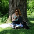 K.T. Epperson of Fayetteville reads “The Heart is a Lonely Hunter” by Carson McCullers on Wednesday ...