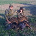 Jim and Elisa Daniel show two Merriam's species of wild turkey they killed in Texas in 2011 when Eli...