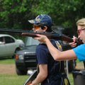 Natalie Akers with the Shiloh Christian School trap shooting team fires at a flying clay target duri...