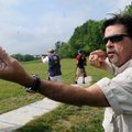 Students improve their scores from several volunteer coaches such as Roy Cordell, who demonstrates o...