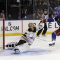 New York Rangers forward Chris Kreider (center) scores the winning goal past Boston Bruins goalie Tu...
