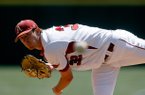 Arkansas pitcher Randall Fant delivers a pitch against LSU during the top of the first inning on Sunday, April 14, 2013, at Baum Stadium in Fayetteville.