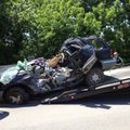 Emergency crews extract a vehicle involved in a fatal accident on Arkansas 161 in Scott on Friday.