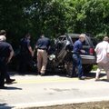 Emergency crews extract a vehicle involved in a fatal accident on Arkansas 161 in Scott on Friday.