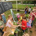 Natalie Freeman, left, program coordinator for Apple Seeds, helps Root Elementary School Garden Club...