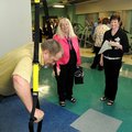 Mike Gilbert, from left, uses workout equipment Thursday as Carolene Thornton, director ChildCare Aw...
