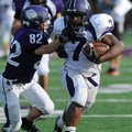 Fayetteville’s Rashad Brown, right, fends off Andrew Moore as he carries the ball through the defens...