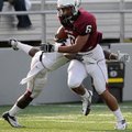 Cua Rose, left, whips his body around Deandre Murray in an attempt to stop his breakaway run Friday ...