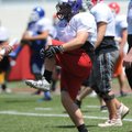 Sam Threlkeld, Fayetteville lineman, participates in drills Monday during football camp at the Unive...