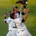 Roman Hernandez, left, Mitch Canham, front, and Whit Merrifield, Northwest Arkansas Naturals players...