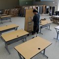 Kyle Lee, with Moser Corporation, moves a table Tuesday, June 11, 2013 to a classroom at Janie Darr ...